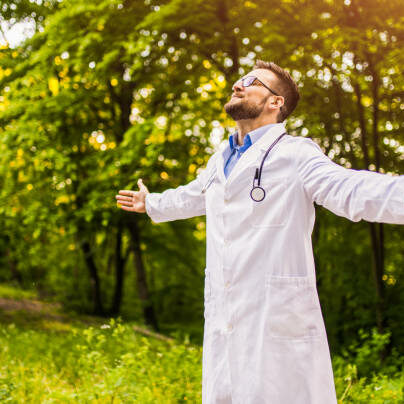 holisticdoc Young healthcare worker decided to work with nature from now on. He is enjoying his time in nature. Dreamlike.